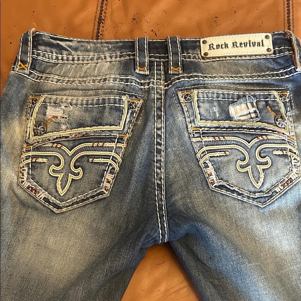 Rock Revival Faded Blue Jeans with Embroidered Pockets